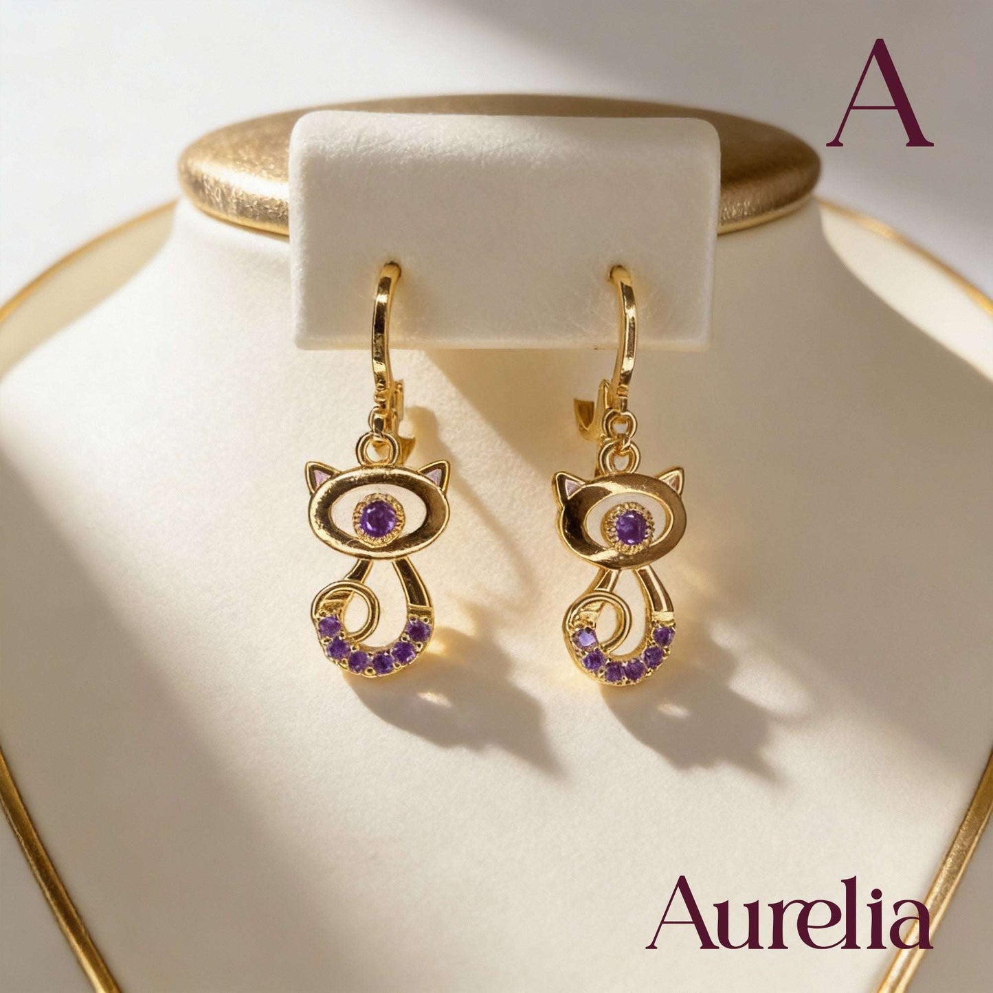 ARETES LARGOS GATO CON BRILLANTES LILA