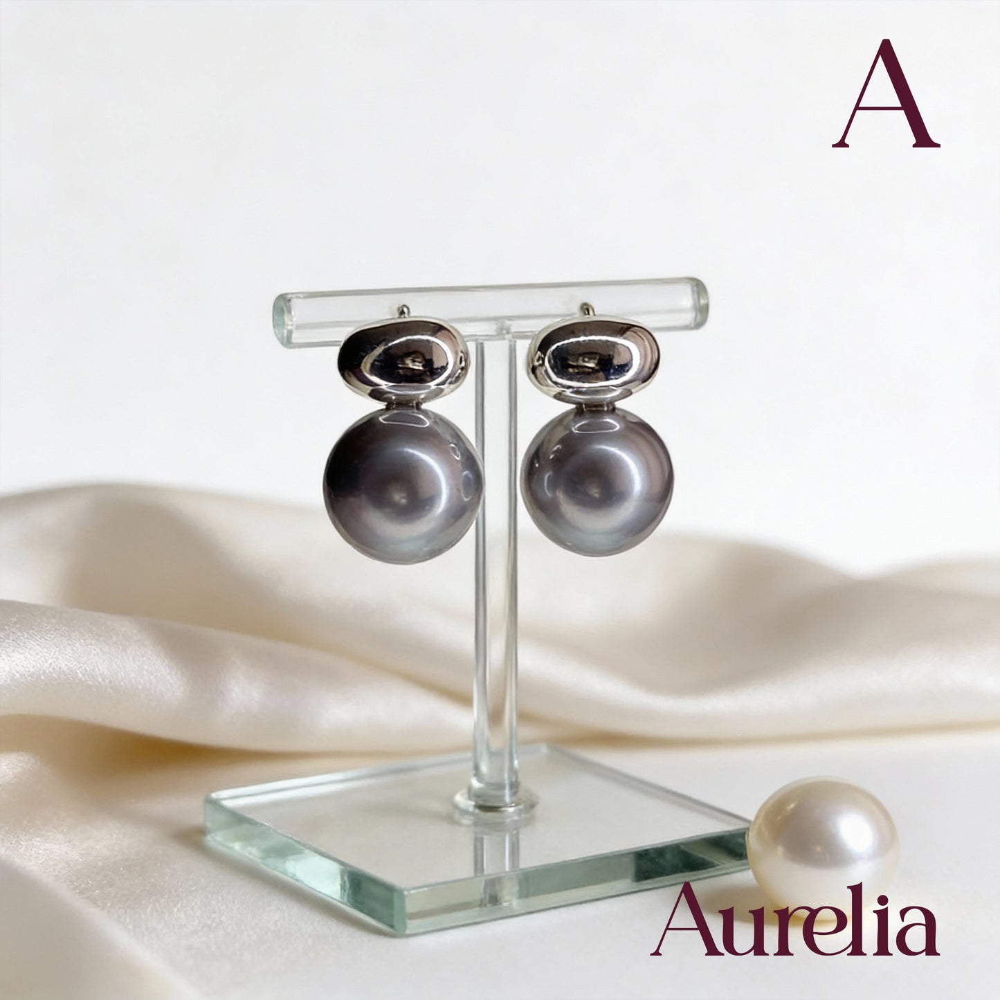 ARETES DOBLE CON PERLA MORADA