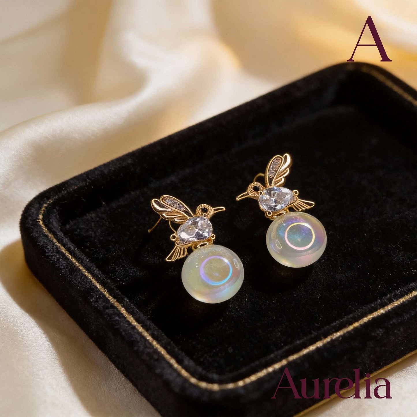 ARETES COLIBRI Y BOLA TRASLUCIDA