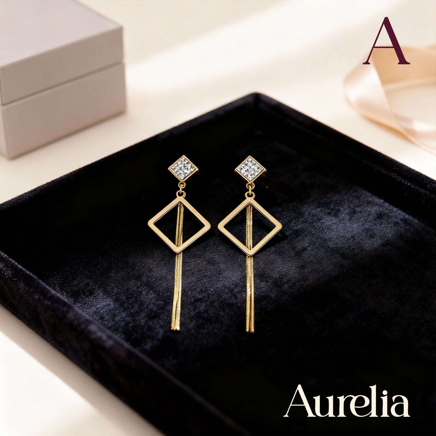 ARETES LARGOS ROMBO CON DETALLE PLATEADO