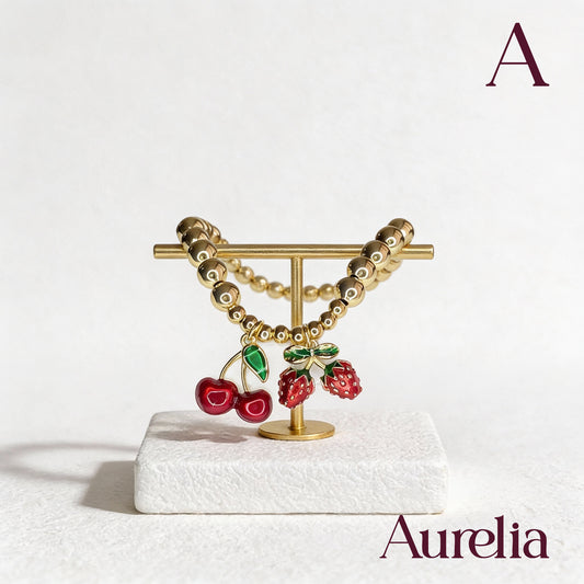 PULSERA CAUCHO CEREZAS Y FRESAS