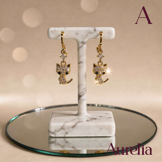 ARETES LARGOS GATO BLANCO Y BRILLANTE BLANCO