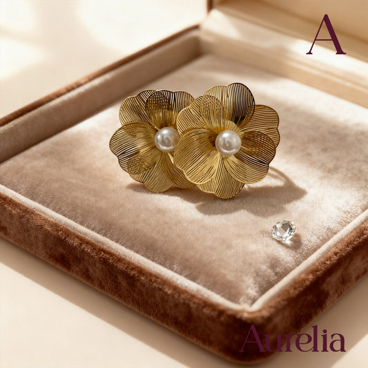 ARETES FLOR LINEAS Y PERLA  EN EL CENTRO