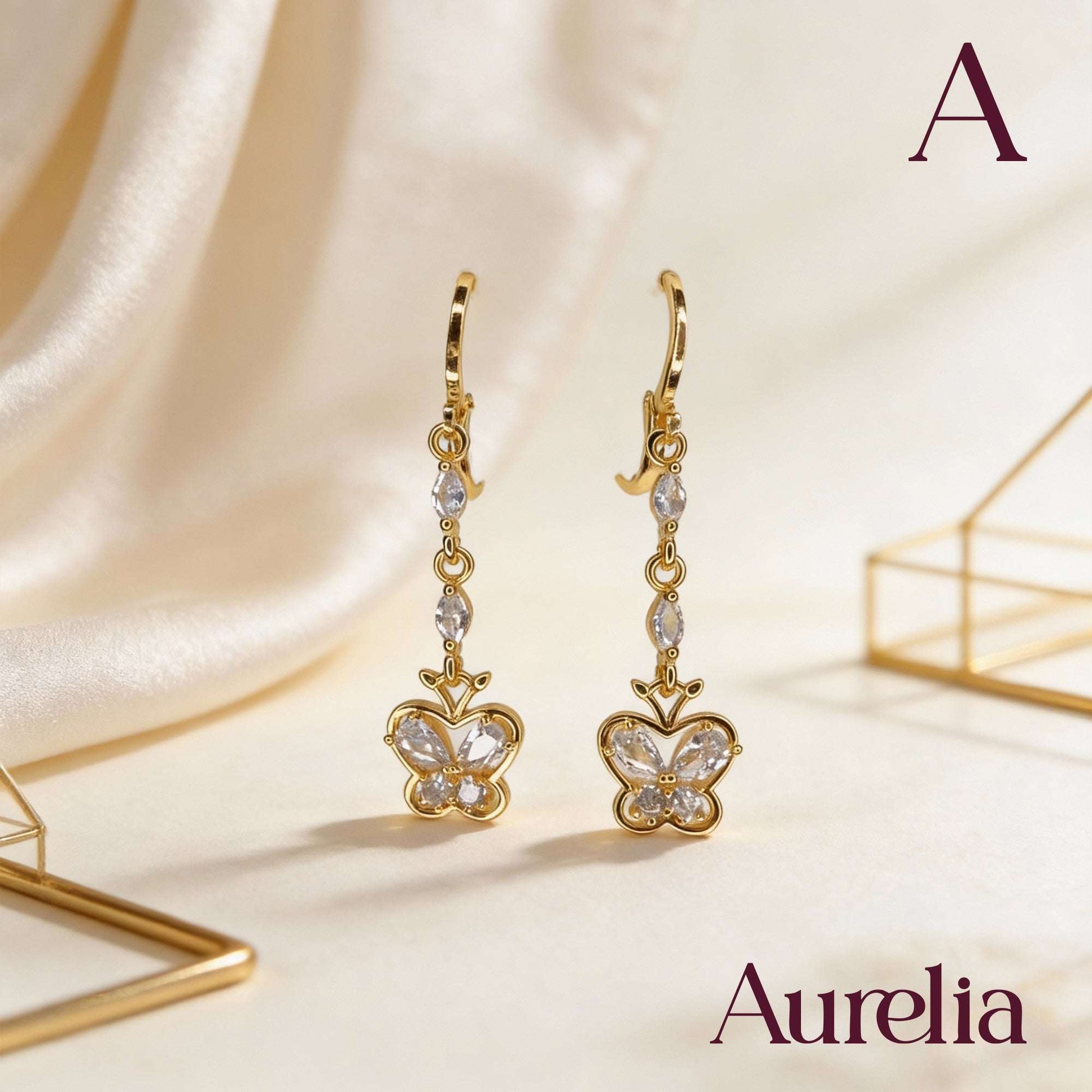 ARETES LARGOS MARIPOSA BLANCA Y BRILLANTES BLANCOS