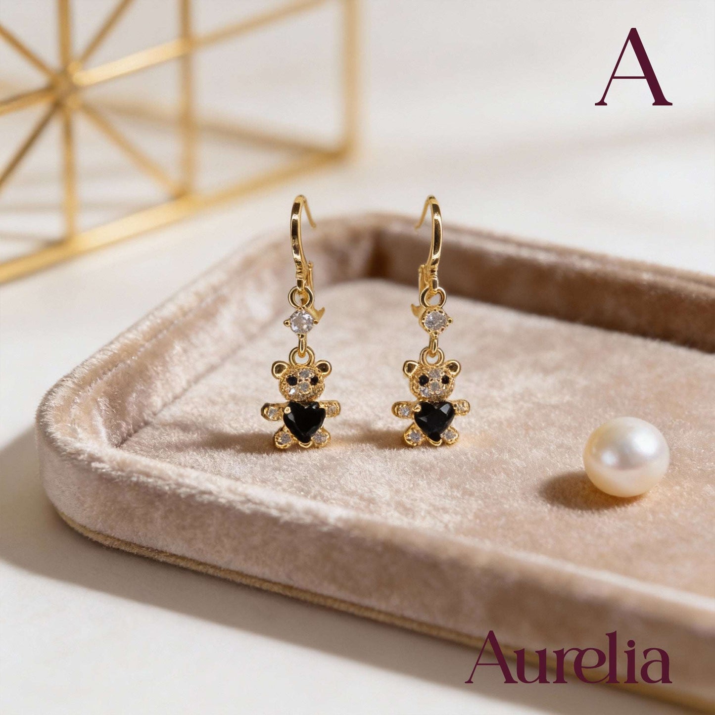 ARETES LARGOS OSO BLANCO CON CORAZON NEGRO