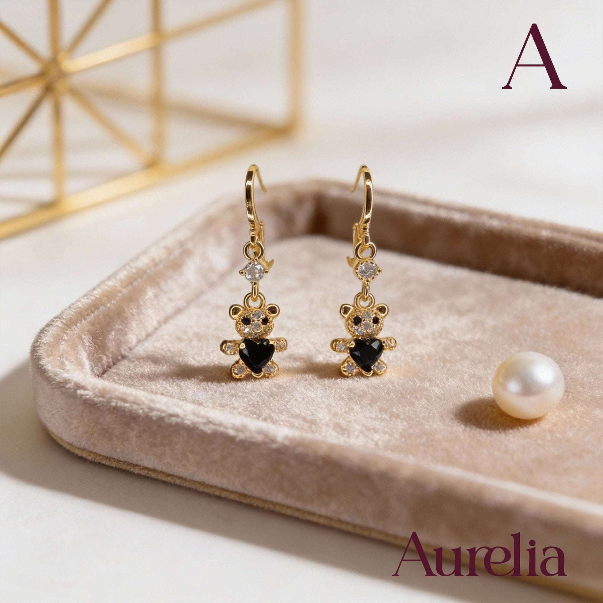 ARETES LARGOS OSO BLANCO CON CORAZON NEGRO