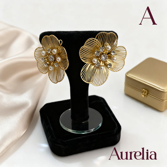 ARETES FLOR LINEAS Y FLOR BRILLANTE EN EL CENTRO
