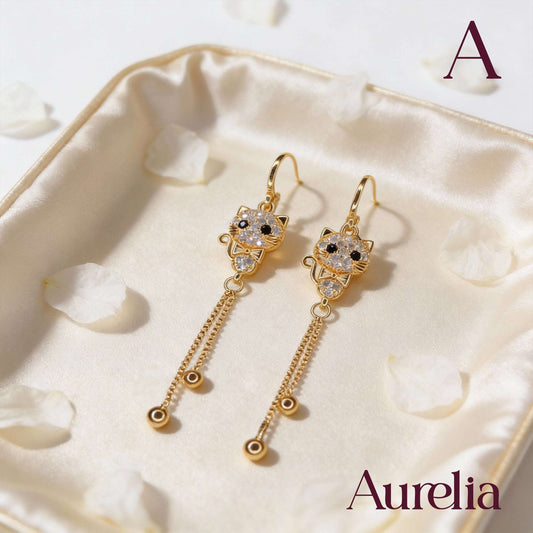 ARETES LARGOS GATO BLANCO Y BOLAS