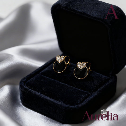 ARETES CIRCULO NEGRO Y MINI CORAZON BRILLANTE