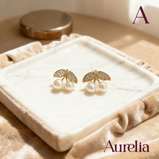 ARETES CEREZAS BLANCAS Y HOJAS BRILLANTES
