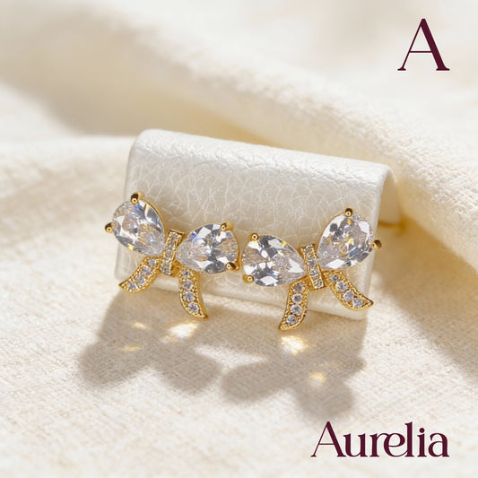 ARETES MOÑO CON BRILLANTES BLANCOS