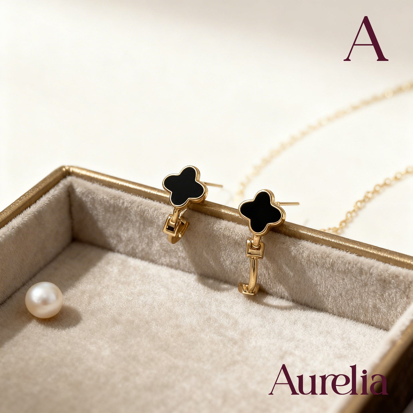 ARETES CANDONGAS MINI TREBOL 4 HOJAS NEGRO