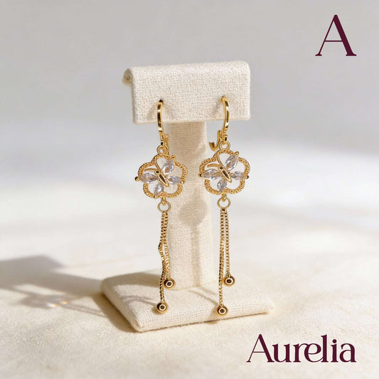 ARETES LARGOS MARIPOSA BLANCA EN FLOR Y BOLAS