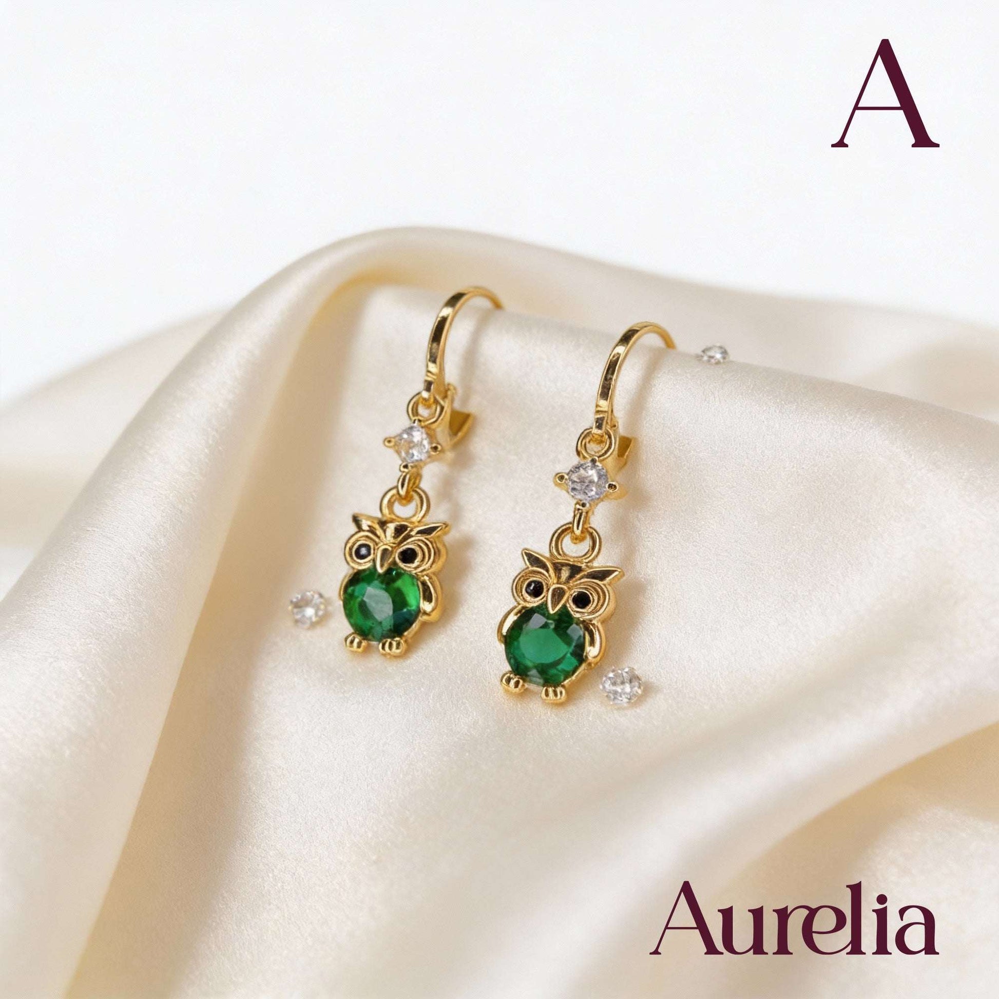 ARETES LARGOS BUHO VERDE Y BRILLANTE