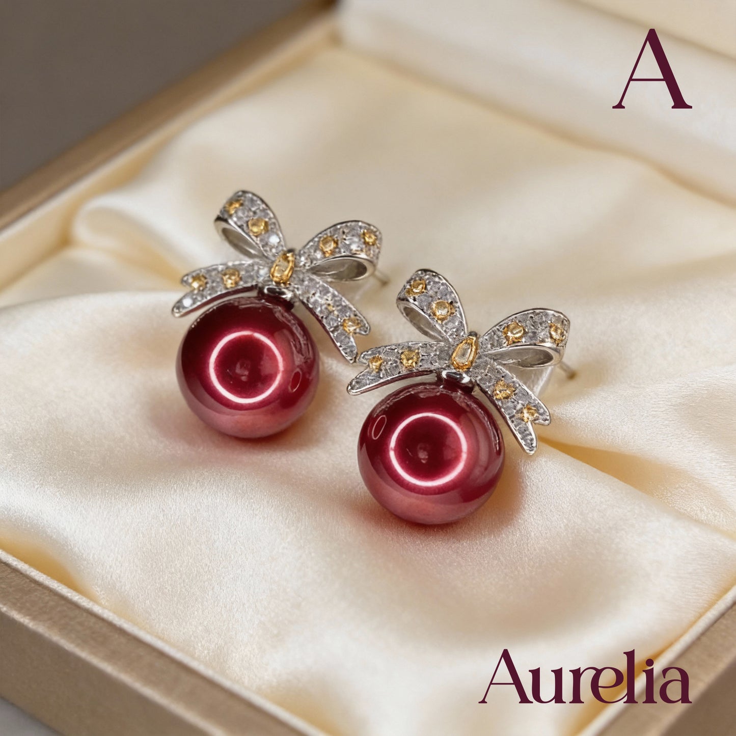 ARETES MOÑO BRILLANTE Y PERLA FUCSIA GRANDE