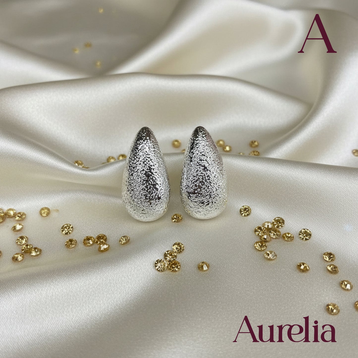 ARETES GOTA LARGA CON TEXTURA