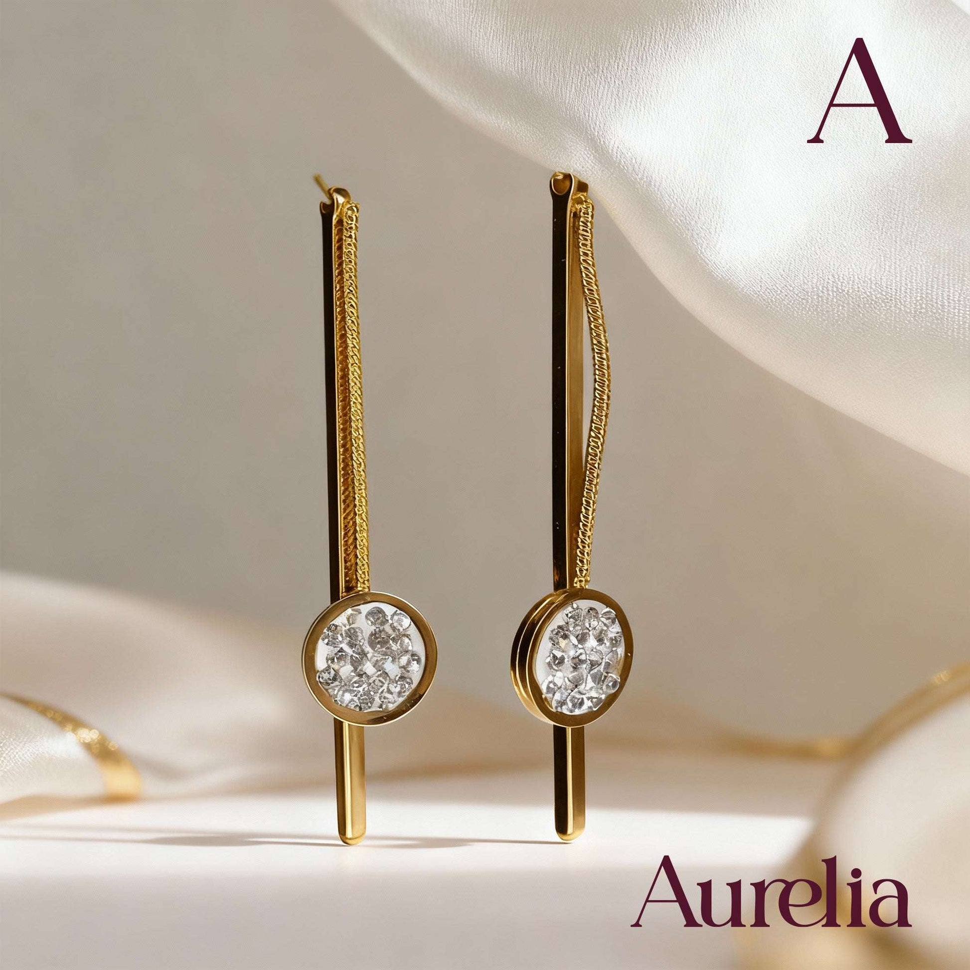 ARETES LARGOS PALO Y BOLA CON DETALLE PLATEADO