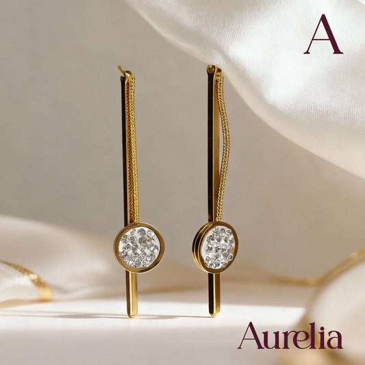 ARETES LARGOS PALO Y BOLA CON DETALLE PLATEADO