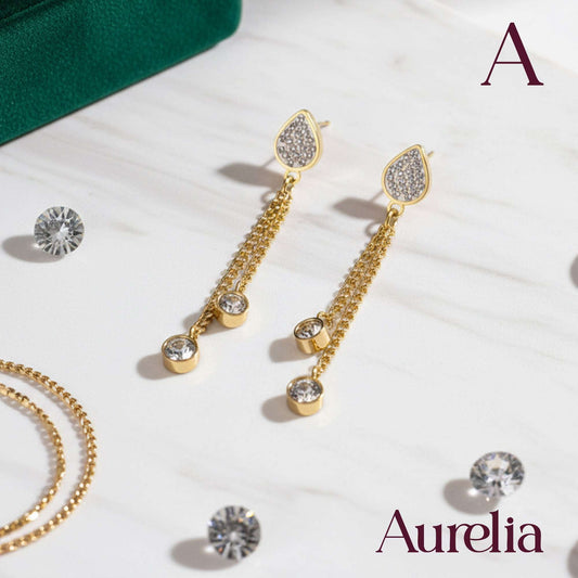 ARETES LARGOS GOTA Y BOLAS PLATEADAS