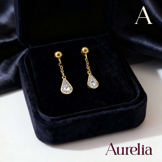 ARETES LARGOS GOTA BRILLANTE PLATEADO CON BOLAS DORADAS