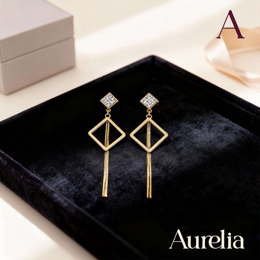 ARETES LARGOS ROMBO CON DETALLE PLATEADO