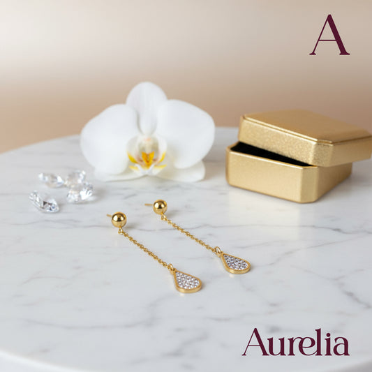 ARETES LARGOS PERLAS BLANCAS Y ROMBOS PLATEADOS