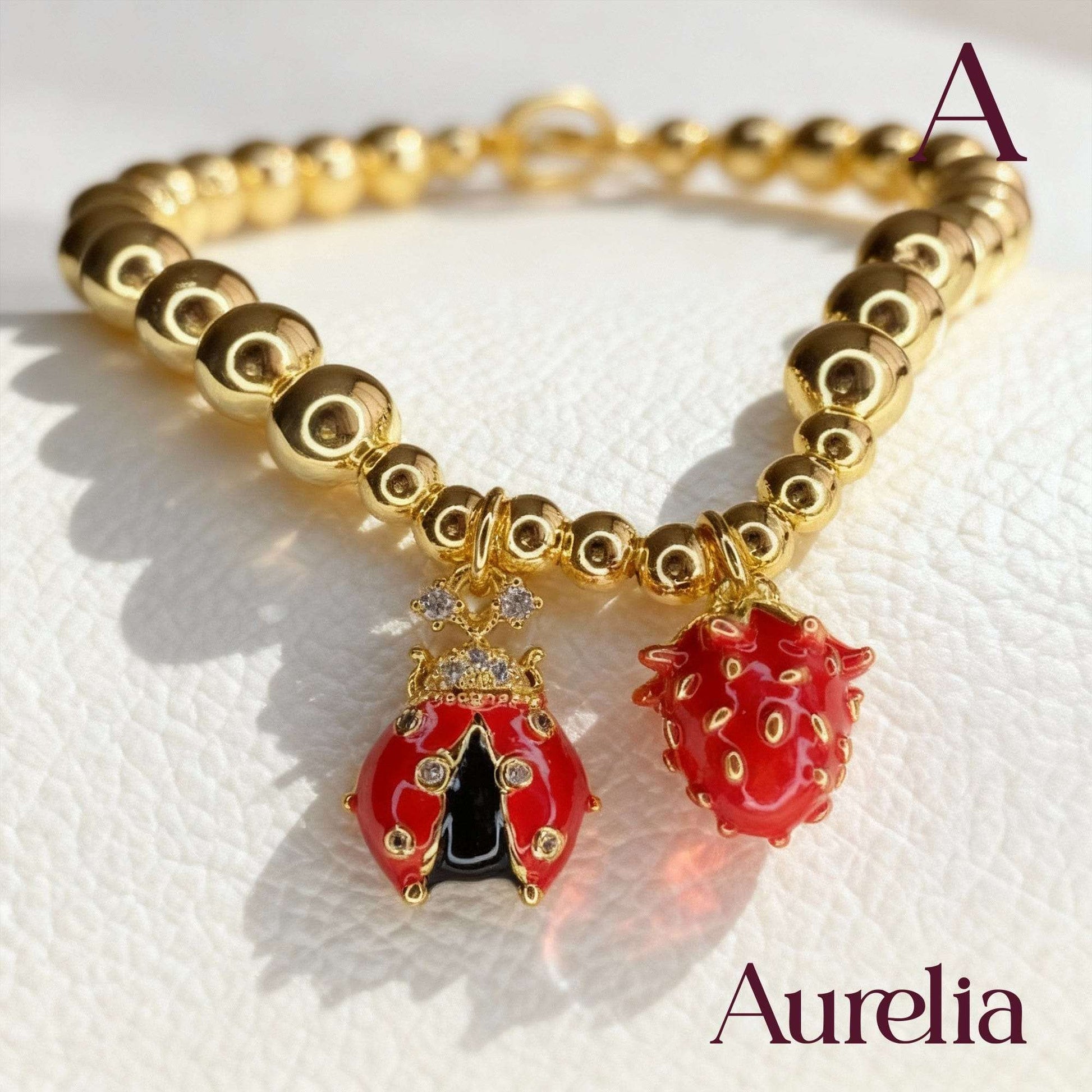 PULSERA CAUCHO MARIQUITA Y FRESA