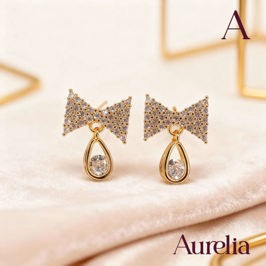 ARETES MOÑO BRILLANTE BLANCO